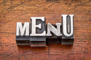 menu word in metal type